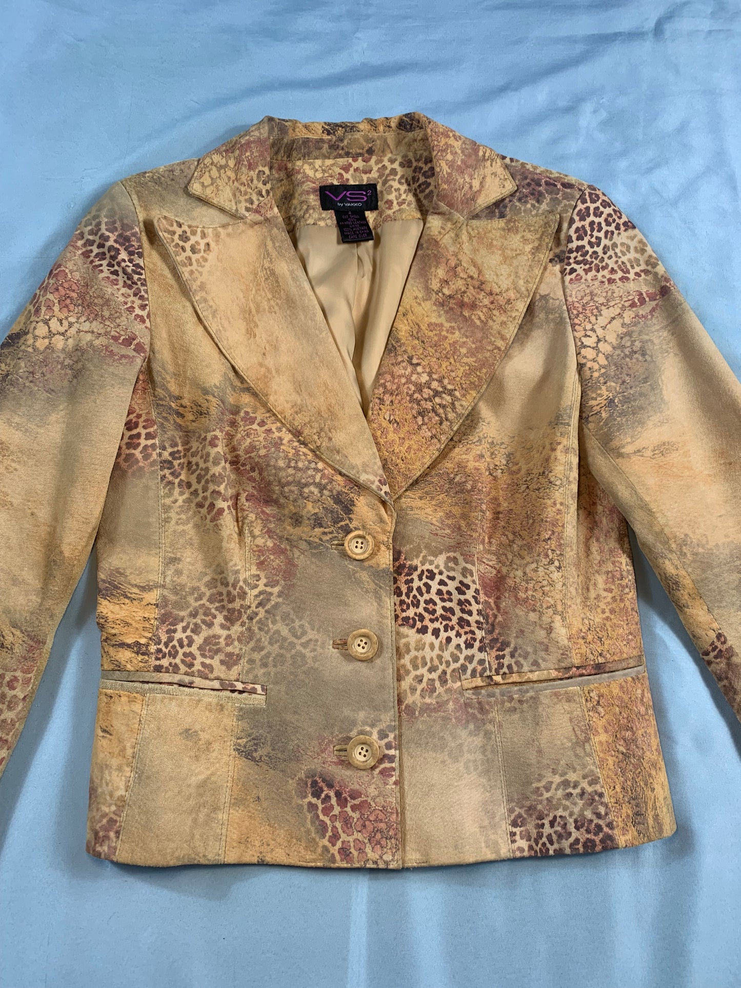 Patterned jacket on a light blue fabric background