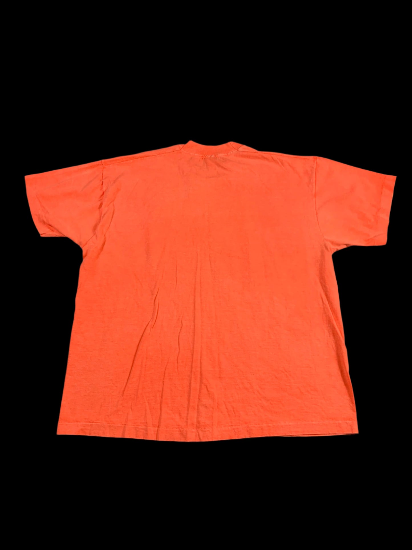 Orange t-shirt on a gray surface
