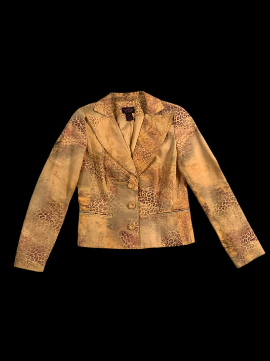 Brown leather jacket with patterned design on a gray surface