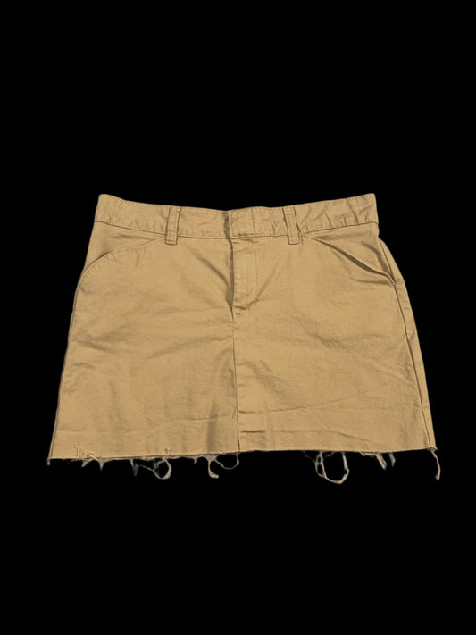 Beige shorts on a light gray background